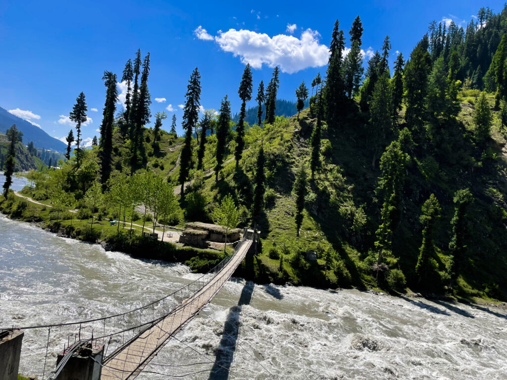 wooden-bridge-is-river-that-has-bridge-that-says-river